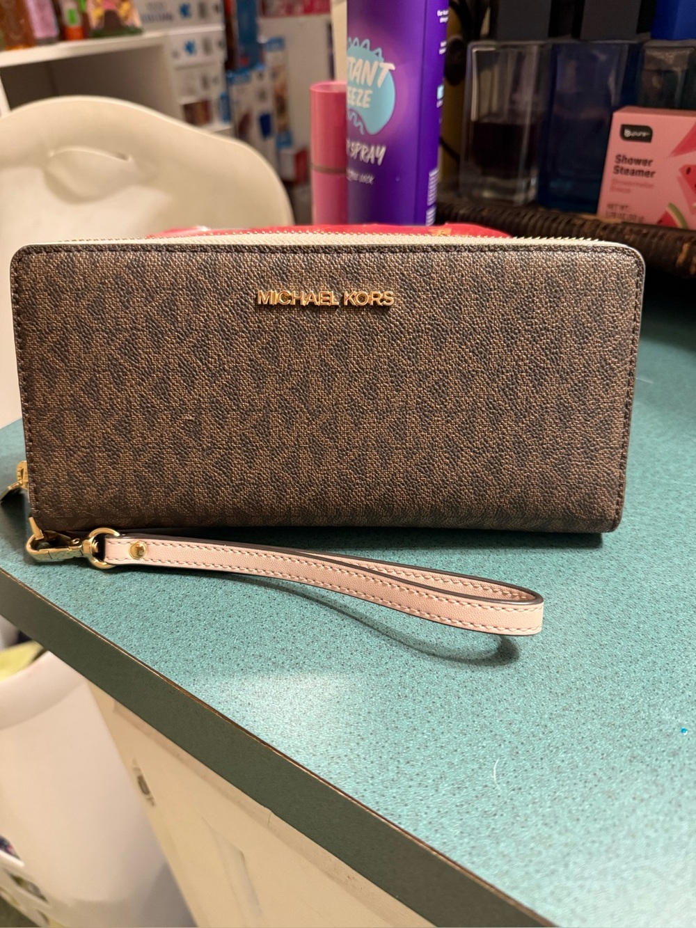 Michael Kors Brown Signature Zip-Around Wristlet with Pink Strap